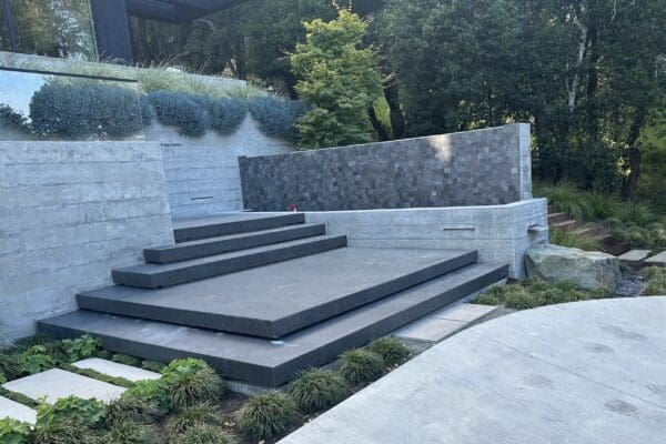 Stairs with recessed lights and tiled wall